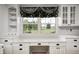 Close up of kitchen desk, window, and built-in storage cabinets at 303 E County Road 500 N, Pittsboro, IN 46167