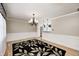 Open-concept living room with a stylish rug and chandelier lighting at 303 E County Road 500 N, Pittsboro, IN 46167