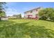 Expansive backyard featuring a large deck with patio furniture and a shed at 360 Myers Lake Dr, Noblesville, IN 46062