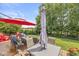 Outdoor deck featuring dining and lounge furniture, umbrellas, and landscaping at 360 Myers Lake Dr, Noblesville, IN 46062