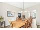 Charming dining room featuring a wooden table, chairs and view to the living area at 360 Myers Lake Dr, Noblesville, IN 46062