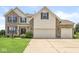 Two-story home featuring brick accents, neutral siding, and a three-car attached garage at 360 Myers Lake Dr, Noblesville, IN 46062