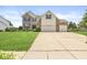 Charming two-story home features a well-manicured lawn, brick accents, and a two car garage at 360 Myers Lake Dr, Noblesville, IN 46062