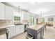 Open-concept kitchen with white cabinets, stainless steel appliances, and a center island at 360 Myers Lake Dr, Noblesville, IN 46062
