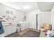 Bright laundry room with washer, dryer, folding counter, and storage, offering functionality and convenience at 360 Myers Lake Dr, Noblesville, IN 46062