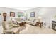 Charming living room with neutral tones, featuring comfortable seating, a fireplace, and large windows for natural light at 360 Myers Lake Dr, Noblesville, IN 46062