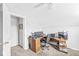 This office features a ceiling fan, a desk with multiple monitors, and is painted with light gray walls at 360 Myers Lake Dr, Noblesville, IN 46062