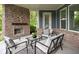 Comfortable outdoor space with fireplace, furniture, and brick columns at 3720 Abney Highland Dr, Zionsville, IN 46077