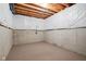 Unfinished basement with concrete walls, wooden beams, and carpeting at 3720 Abney Highland Dr, Zionsville, IN 46077