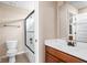 Bathroom featuring a vanity with sink and a shower and bathtub with glass doors at 3720 Abney Highland Dr, Zionsville, IN 46077