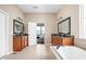 Spacious bathroom boasts dual sinks, soaking tub and shower at 3720 Abney Highland Dr, Zionsville, IN 46077
