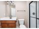 Bathroom features wood cabinet with sink and shower with glass doors at 3720 Abney Highland Dr, Zionsville, IN 46077