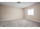 Empty bedroom with neutral walls, plush carpeting, and a window at 3720 Abney Highland Dr, Zionsville, IN 46077