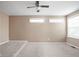 Bedroom with neutral walls, carpet, ceiling fan, and natural light from two windows at 3720 Abney Highland Dr, Zionsville, IN 46077