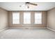 Bedroom featuring neutral walls, carpet, and natural light from three windows at 3720 Abney Highland Dr, Zionsville, IN 46077
