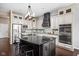 Eat-in kitchen with granite island and countertops, stainless steel appliances and custom lighting at 3720 Abney Highland Dr, Zionsville, IN 46077