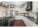 Spacious kitchen featuring stainless steel appliances, mosaic backsplash, and modern countertops at 3720 Abney Highland Dr, Zionsville, IN 46077