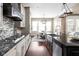 Gourmet kitchen boasts stainless steel appliances, large island, and dining area at 3720 Abney Highland Dr, Zionsville, IN 46077