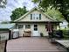 Inviting back deck with outdoor seating and a grill, perfect for relaxing or entertaining guests at 388 N Ohio St, Martinsville, IN 46151