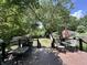 A backyard wooden deck overlooks a well-maintained lawn that is perfect for outdoor entertaining at 388 N Ohio St, Martinsville, IN 46151