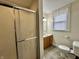 Bright bathroom with a shower, a tiled floor, a new toilet, and a modern vanity with ample natural light at 388 N Ohio St, Martinsville, IN 46151