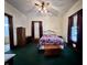 Spacious bedroom featuring a cozy bed, wood furnishings and natural light from windows at 388 N Ohio St, Martinsville, IN 46151