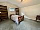 Bedroom with a single bed, carpeted floors, a window, and ample closet space at 388 N Ohio St, Martinsville, IN 46151