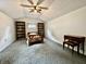 Upstairs bedroom featuring bookshelves, a wooden desk, and neutral-toned carpeting at 388 N Ohio St, Martinsville, IN 46151