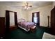 Bedroom featuring a cozy bed, wood furnishings and natural light from windows at 388 N Ohio St, Martinsville, IN 46151