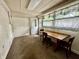 Bright dining area with a rustic table and chairs, featuring natural light and classic window coverings at 388 N Ohio St, Martinsville, IN 46151