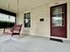 Inviting front porch with a charming porch swing, perfect for relaxing and enjoying the outdoors at 388 N Ohio St, Martinsville, IN 46151