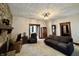 Living room with stone fireplace, neutral colored sofa and dark wood trim at 388 N Ohio St, Martinsville, IN 46151