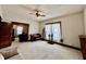 Open living room with piano, dark wood trim, plants and large light-filled windows at 388 N Ohio St, Martinsville, IN 46151