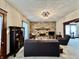 Inviting living room with a stone fireplace, neutral walls, and hardwood trim at 388 N Ohio St, Martinsville, IN 46151