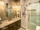 Elegant bathroom featuring granite counters, decorative lighting, and a glass-enclosed shower at 414 E Main St, Plainfield, IN 46168