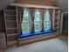Attic bedroom featuring built-in shelving, window seat, neutral carpeting and natural light at 414 E Main St, Plainfield, IN 46168