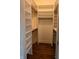 Walk-in closet with built-in shelving and hanging rods, offering ample storage space at 414 E Main St, Plainfield, IN 46168