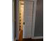 Bright doorway with a sliding paneled door and dark wood floors at 414 E Main St, Plainfield, IN 46168