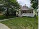 Charming single Gathering home featuring a lovely lawn and covered front porch at 414 E Main St, Plainfield, IN 46168