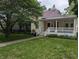 Charming single Gathering home featuring a lovely lawn and covered front porch at 414 E Main St, Plainfield, IN 46168