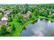 Aerial view of the property, highlighting its proximity to a pond and landscaped surroundings at 4279 Redwood Ct, Zionsville, IN 46077