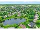 A stunning aerial view of the neighborhood shows lush greenery, beautiful homes, and a serene community pond at 4279 Redwood Ct, Zionsville, IN 46077