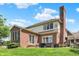 The brick home boasts a well-maintained lawn and patio, perfect for outdoor relaxation and entertaining at 4279 Redwood Ct, Zionsville, IN 46077