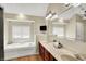 Bright bathroom with a soaking tub, dual sinks, and updated fixtures at 4279 Redwood Ct, Zionsville, IN 46077
