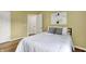 Bright bedroom with modern decor, light hardwood floors, and a comfortable-looking bed at 4279 Redwood Ct, Zionsville, IN 46077