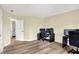 Bright bedroom with light wood floors and two windows providing natural light at 4279 Redwood Ct, Zionsville, IN 46077