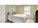 Bedroom with wood floors, a queen bed and a window view at 4279 Redwood Ct, Zionsville, IN 46077