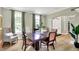 Elegant dining room with hardwood floors, large windows, and neutral wall paint at 4279 Redwood Ct, Zionsville, IN 46077