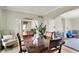 Open-concept dining area with hardwood floors, a neutral color scheme, and access to additional spaces at 4279 Redwood Ct, Zionsville, IN 46077