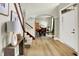 Inviting foyer with hardwood floors, staircase, and a view into the formal dining area at 4279 Redwood Ct, Zionsville, IN 46077
